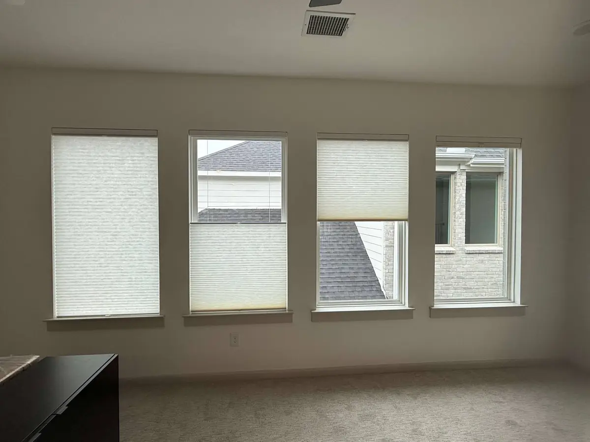 Light-filtering shades across a row of windows