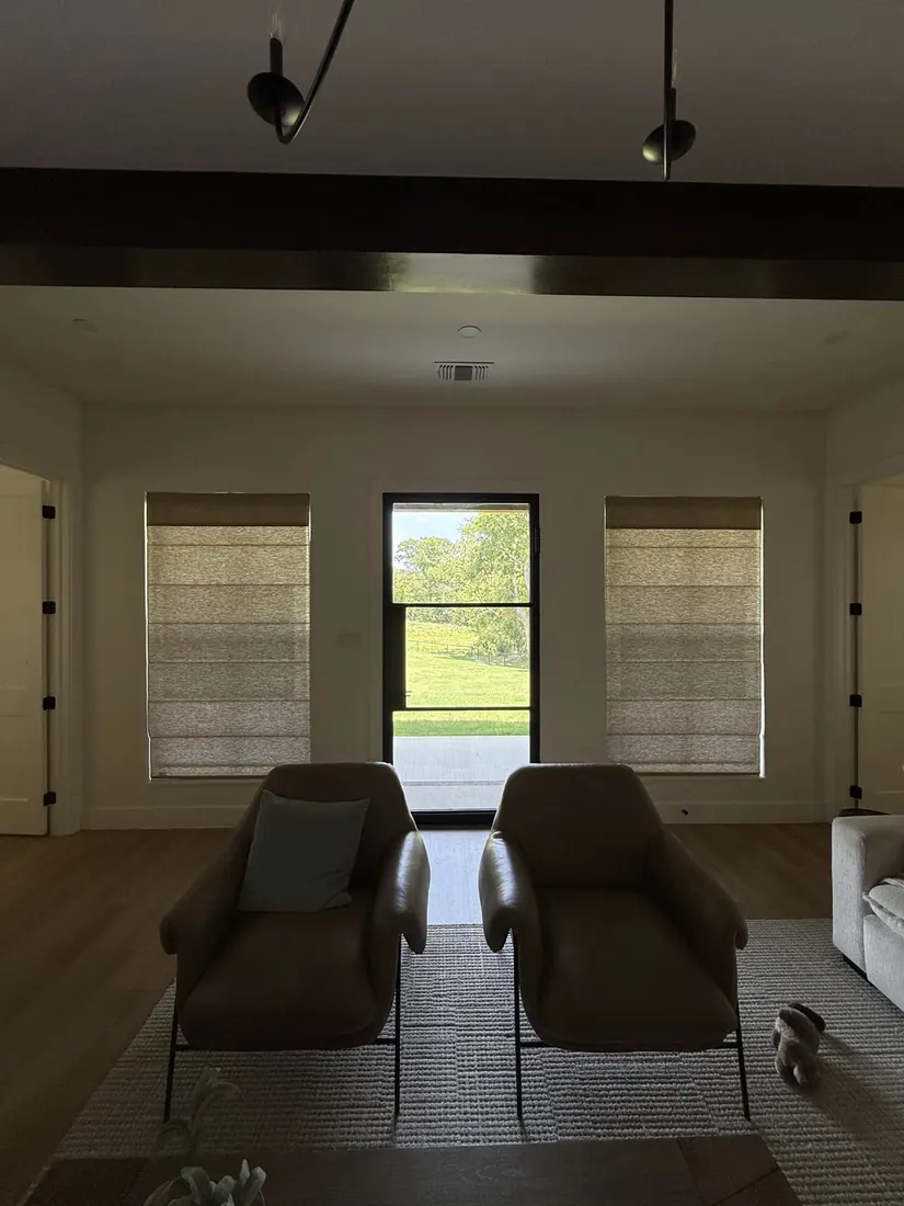 Roman shades by a patio door